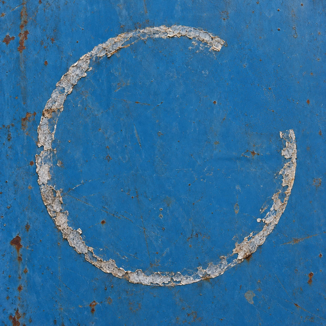White adhesive curls around blue metal with one peeled-away opening.